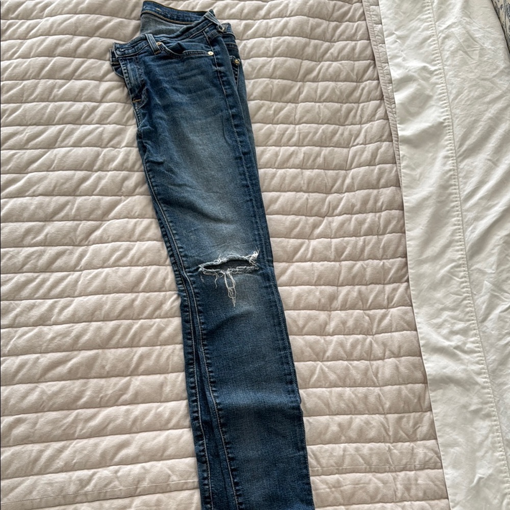 Distressed Blue Denim Jeans